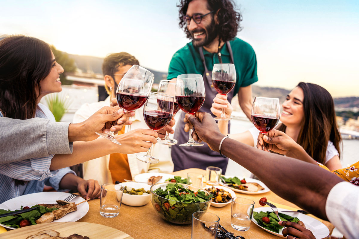people drinking red wine