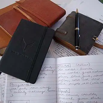 a stack of journals and papers